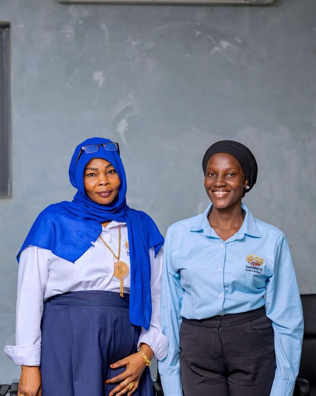 Two Davinnette Forex Bureau staff in uniform